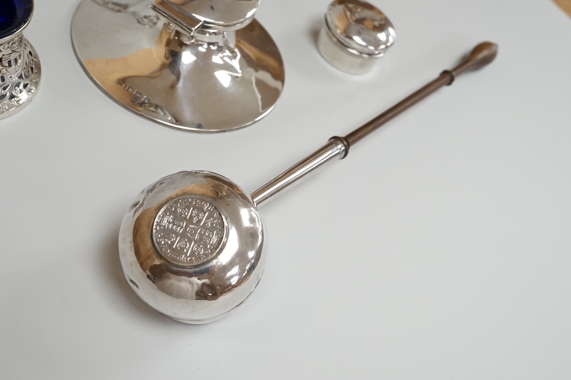 A George V silver mounted capstan inkwell, A & J Zimmerman Ltd, Birmingham, 1913, diameter 11.4cm, together with a small silver bowl, a small silver 'dish ring' salt(a.f.), a silver two handled bowl, a silver pill box an
